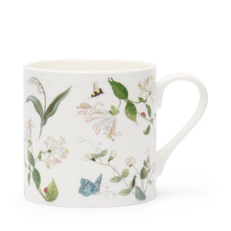 A white fine bone china mug decorated with a delicate botanical pattern of green leaves, white flowers, a blue butterfly, and a small bee, shown on a clean white background.