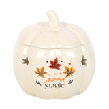 Ceramic pumpkin-shaped wax burner with autumn-themed design on a white background