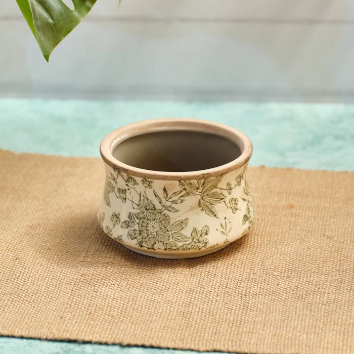 A small Green Floral Planter on a hessian runner