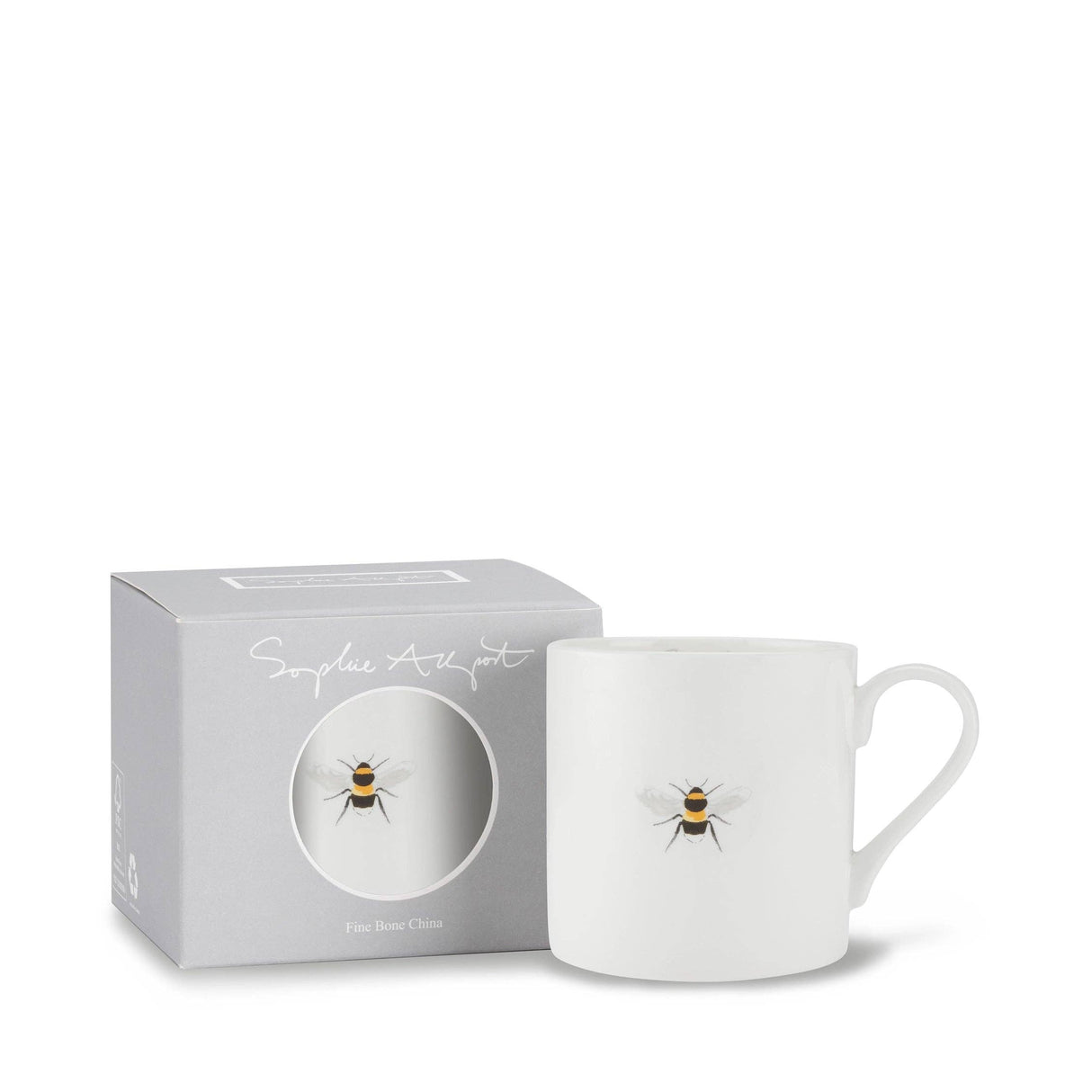 A white ceramic mug with a small bumblebee illustration next to its light gray packaging box, which features a circular cutout showing the mug's design.