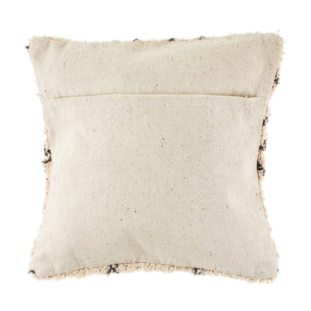 The reverse side of a cream and black berber style scatter cushion, showing the reverse is plain cream